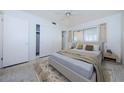 Cozy bedroom featuring a comfortable bed, neutral tones, and ample closet space at 4154 57Th N St # 173, Kenneth City, FL 33709