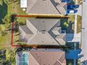 Aerial view of backyard, property lines, nearby homes, and screened in pool at 4506 Mapletree Loop, Wesley Chapel, FL 33544