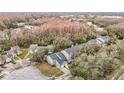 An aerial view of a multi-unit dwelling, complete with surrounding trees and other community homes at 5832 Red Cedar Ln, Tampa, FL 33625