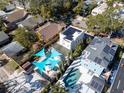 Aerial view of a neighborhood house with a large solar panel array, and a backyard pool at 2528 3Rd N Ave, St Petersburg, FL 33713