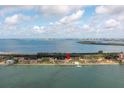 Beautiful waterfront condos with a swimming pool and dock surrounded by lush landscaping at 7520 Sunshine Skyway S Ln # T18, St Petersburg, FL 33711