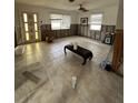 Partially renovated living room with tiled floors, and updated windows, showing an opportunity for customization at 1742 Mississippi Ne Ave, St Petersburg, FL 33703