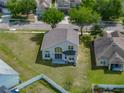 Aerial view of the home's backyard showing a large grassy area and covered patio at 4351 Highcroft Dr, Wesley Chapel, FL 33545