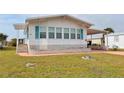 Charming single-story home with a well-maintained lawn and carport at 112 Saint Pierres Way, Apollo Beach, FL 33572