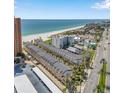 Expansive aerial view of beachfront condo complex with a view of the ocean and city at 17960 Gulf Blvd # 103, Redington Shores, FL 33708
