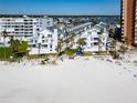 Beautiful beachfront condos featuring white exteriors, private balconies, and well-maintained landscaping at 17960 Gulf Blvd # 103, Redington Shores, FL 33708