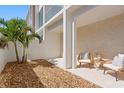 Private patio with gravel landscaping, modern furnishings, and neutral tones at 2702 N Woodrow Ave # 2, Tampa, FL 33602