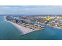 Stunning aerial view of waterfront community with beach access, waterways, and prime location at 421 77Th Ave, St Pete Beach, FL 33706