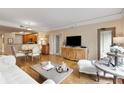 Open concept living space with hardwood floors, comfortable seating, and seamless transition to dining and kitchen at 275 Bayshore Blvd # 408, Tampa, FL 33606