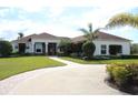 Beautiful single story home featuring an elegant entryway, lush lawn, and a winding driveway bordered with pavers at 6367 Foxbrook Trl, Parrish, FL 34219