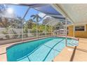 A refreshing screened-in pool with crystal-clear water, surrounded by a spacious deck for lounging and entertaining at 970 45Th Ne Ave, St Petersburg, FL 33703