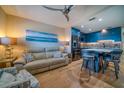 Cozy living room with modern kitchen, sleek cabinets, and stylish island seating at 8565 W Gulf Blvd # 17S, Treasure Island, FL 33706