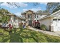 Well maintained home with a brick facade and lush landscaping in the front yard at 363 Sanctuary Dr, Crystal Beach, FL 34681