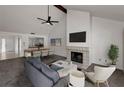 Spacious living room area with high ceilings, fireplace, with living room open to the kitchen at 8005 Bardmoor Pl # 202I, Seminole, FL 33777