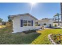 Well maintained single Gathering home with neatly landscaped yard and blue shutters at 8418 Flagstone Dr, Tampa, FL 33615
