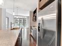 Modern kitchen island featuring a stainless steel sink and faucet, plus stainless steel appliances at 111 N 12Th St # 1619, Tampa, FL 33602