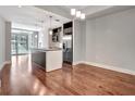 Open concept kitchen with dark cabinets, stainless steel appliances, and a large island at 111 N 12Th St # 1619, Tampa, FL 33602