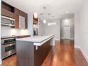 Spacious kitchen with stainless steel appliances, granite counters, and hardwood floors at 111 N 12Th St # 1619, Tampa, FL 33602