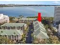 Spacious multi-unit building with lush landscaping, ample parking, and a tranquil waterfront view at 1203 Bay Club Cir # 1203, Tampa, FL 33607