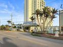 The entrance to the towers is guarded by a security booth and lined with palm trees at 420 64Th Ave # 1005, St Pete Beach, FL 33706