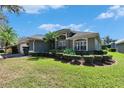 Well-maintained home with manicured landscaping and lush green lawn at 3110 Bent Creek Dr, Valrico, FL 33596