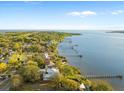 Breathtaking aerial view of waterfront homes with private docks along the riverfront under a sunny sky at 316 Shore E Dr, Oldsmar, FL 34677