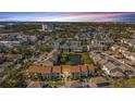 A beautiful aerial view of the condo community, featuring a serene lake, lush trees, and well-kept grounds at 13600 Egret Blvd # 204K, Clearwater, FL 33762