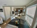 Sunlit dining area showcasing an open floor plan that flows into a modern kitchen and cozy living room at 2427 10Th S Ave, St Petersburg, FL 33712