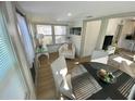 Bright dining area features natural light, gray accents, and stylish modern furnishings at 2427 10Th S Ave, St Petersburg, FL 33712