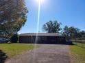 Charming brick home with carport and well-maintained front yard offers comfort and convenience at 2601 11Th Se Ave, Ruskin, FL 33570