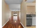Bright and spacious living room with hardwood floors and sliding glass doors to the backyard at 5809 War Admiral Dr, Wesley Chapel, FL 33544