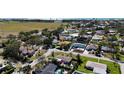 An aerial view of a neighborhood showcasing well-maintained homes, lush greenery, and streetscapes at 1309 Nokomis S Ave, Venice, FL 34285