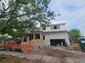 Two-story under construction home featuring a garage and covered porch area at 408 Columbia Dr, Tampa, FL 33606