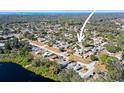Neighborhood aerial view, highlighting the home's location near the lake at 3108 Ash Ct, Dunedin, FL 34698