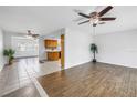Open-concept living room with wood-look flooring and neutral tones throughout at 13851 102Nd Ave, Largo, FL 33774