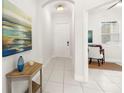 Bright hallway with tile floors, leading to a front door and a glimpse of the office space at 7602 S Desoto St, Tampa, FL 33616