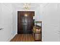 Entryway with double doors, wood floors, and a decorative shelf at 1209 E Cumberland Ave # 505, Tampa, FL 33602