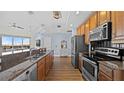 Spacious kitchen with stainless steel appliances, granite countertops, and wood cabinetry at 1209 E Cumberland Ave # 505, Tampa, FL 33602