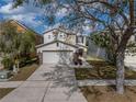 Charming two-story home with two-car garage, long driveway and mature trees at 6324 Magnolia Trails Ln, Gibsonton, FL 33534