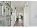 Bright hallway with tile flooring leading to a living area, shows an open floor plan at 4732 Lake Blvd # A, Clearwater, FL 33762