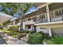 Condo exterior shows the building's architecture, landscaping, and accessibility at 1601 43Rd N St # 133, St Petersburg, FL 33713