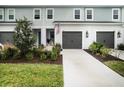 Charming townhome with a well-manicured lawn and attached garage at 8463 Canyon Creek Trl, Parrish, FL 34219