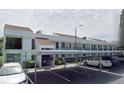 Charming condo featuring assigned covered parking spaces and white exterior at 2060 Marilyn St # 133, Clearwater, FL 33765