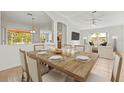 Spacious dining room featuring a large wooden table and natural light at 4251 Whittner Dr, Land O Lakes, FL 34639