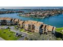 Waterfront condo complex with boat docks, lush landscaping, and a tranquil ambiance at 2775 Kipps Colony S Dr # 105, Gulfport, FL 33707
