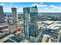 This is an aerial view of a modern high-rise apartment building with stunning city and water views at 777 N Ashley Dr # 1614, Tampa, FL 33602