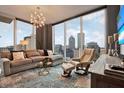 Cozy living room with comfortable seating, large windows, and city views at 777 N Ashley Dr # 1614, Tampa, FL 33602