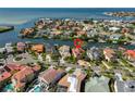 An aerial view of a waterfront community with canals and homes with tile roofs at 1011 Sonata Ln, Apollo Beach, FL 33572