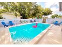 Inviting backyard pool with lounge chairs and stylish decor, perfect for relaxation at 12361 114Th St, Largo, FL 33778