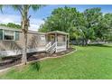 This single-story home features a covered front porch and well-kept landscaping at 12526 Spottswood Dr, Riverview, FL 33579